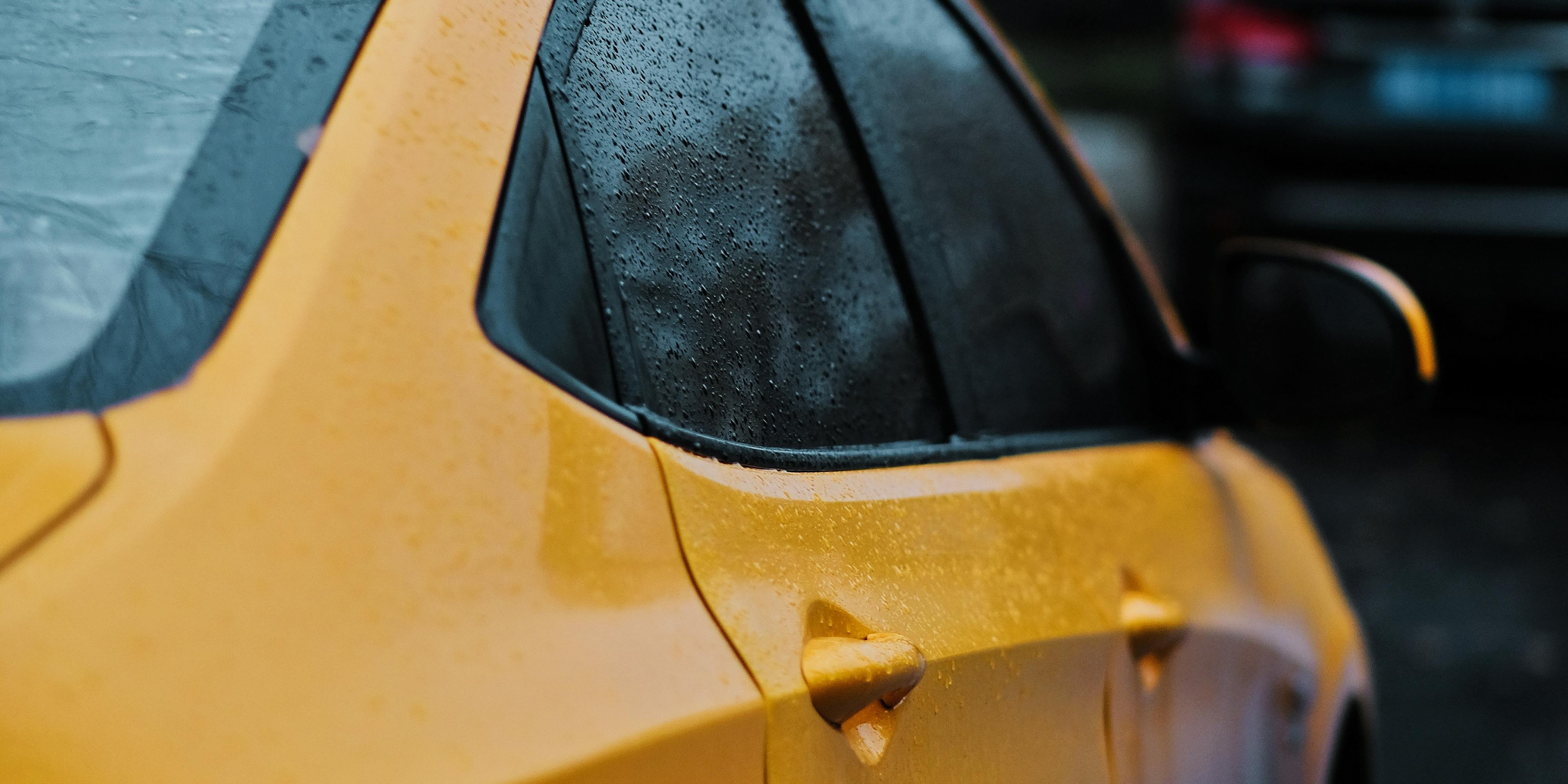 Yellow car Yellow car getting rained on